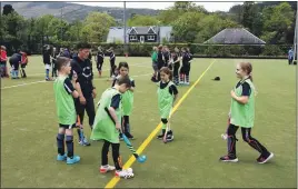  ?? 01_B20AJHC06 ?? Arran player Lynda Fenton with some of her players.