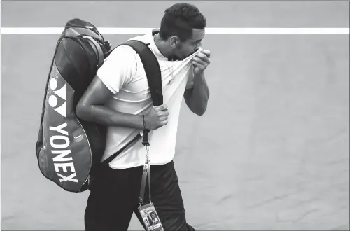  ??  ?? Nick Kyrgios of Australia prepares to leave the court after retiring from the men’s singles match against Steve Johnson of the US on Day 3 of the Shanghai Masters on Tuesday.