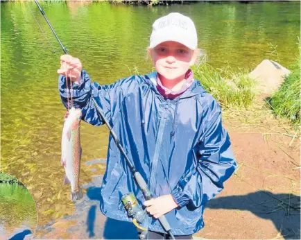  ?? Photos / Supplied ?? Isabelle Ogle (above) with her trout while Chester James (inset) shows off his catch.