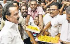  ?? PTI ?? DMK working president MK Stalin is offered sweets by party workers as they celebrate the special court’s acquittal verdict in 2G case in Chennai on Thursday.