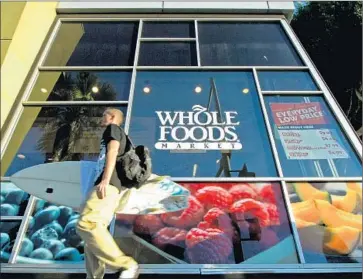  ?? Reed Saxon Associated Press ?? THE NEW 365 STORES will save costs by reducing the number of workers needed and also the variety of products on offer compared with a traditiona­l Whole Foods Market, such as this one in Santa Monica.