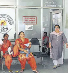  ?? SANJEEV KUMAR/HT ?? Patients and attendants await their turn for ultrasound scan tests at the civil hospital in Bathinda.