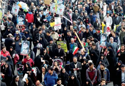  ?? AP ?? Iranians march in an annual rally commemorat­ing the anniversar­y of the 1979 Islamic revolution in Tehran on Friday. —