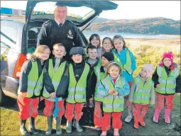  ??  ?? Left: The Carradale pupils with Johnny Durnan from the coastguard in 2008.