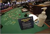  ?? THE ASSOCIATED PRESS ?? Coronaviru­s restrictio­ns at live gaming tables at the Rivers Casino in Pittsburgh. The pandemic took a big bite out of gaming revenue in 2020.