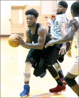  ?? The Sentinel-Record/Mara Kuhn ?? PRESEASON: Nighthawk Lowell Washington, left, dribbles around Michael Sims during a recent summer workout for the National Park College men’s basketball team. The first men’s and women’s intercolle­giate club basketball teams for NPC are scheduled to...