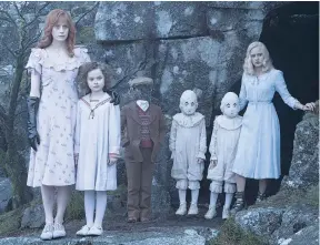  ?? AP ?? In a scene from ‘Miss Peregrine’s Home for Peculiar Children’ are (from left) Lauren McCrostie, Pixie Davies, Cameron King, Thomas Odwell, Joseph Odwell and Ella Purnell.