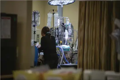  ?? LARRY VALENZUELA — CALMATTERS/CATCHLIGHT LOCAL ?? California's Office of Health Care Affordabil­ity handed down a regulation that aims to limit rising health care costs by capping industry spending increases. Here, a nurse checks on a patient in the emergency room unit of Hazel Hawkins Memorial Hospital in Hollister on March 30, 2023.