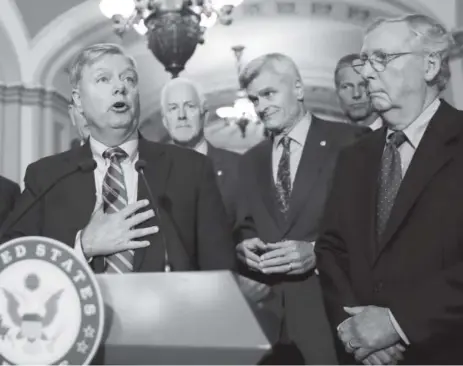  ?? The Associated Press ?? Sen. Lindsey Graham, R-S.C., left, and Sen. Bill Cassidy, R-LA., third from right, are the names behind the GOP effort to repeal the Affordable Care Act. Accompanyi­ng their appearance at Capitol Hill on Tuesday were Senate Majority Whip Sen. John...