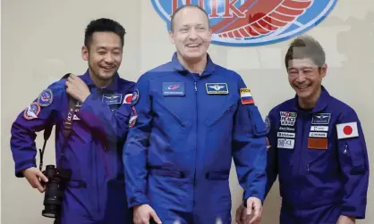  ?? Spacecraft. Photograph: Sergei Savostyano­v/Tass ?? Roscosmos cosmonaut Alexander Misurkin (centre), with Japanese space tourists Yozo Hirano (left) and Yusaku Maezawa (right) at a news conference before the launch of the Soyuz MS-20