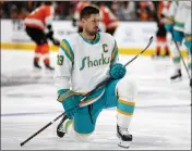  ?? NHAT V. MEYER — BAY AREA NEWS GROUP FILE ?? The San Jose Sharks' Logan Couture (39) kneels on the ice during warmups before their game against the Philadelph­ia Flyers at the SAP Center in San Jose on Dec. 29, 2022.