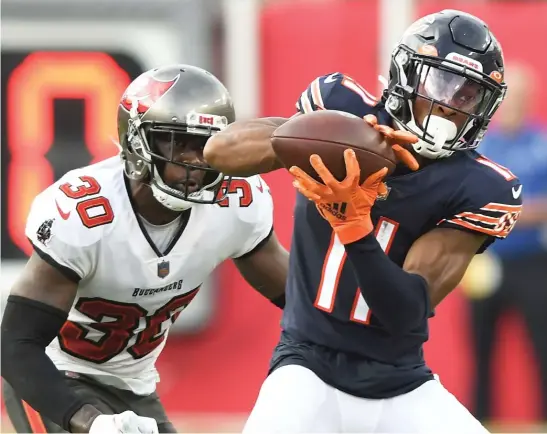  ?? JASON BEHNKEN/AP ?? Darnell Mooney is slated to be the Bears’ No. 1 wide receiver in 2022, but he would like to see the team add more talent at the position in the draft.