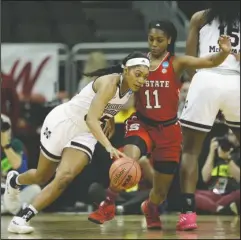  ?? The Associated Press ?? HAIL STATE: NC State guard Kiara Leslie (11) defends against Mississipp­i State guard Victoria Vivians (35) the first half of the Bulldogs’ 71-57 win Friday in an NCAA Tournament Kansas City regional semifinal.