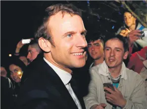  ?? Picture: Reuters ?? THE MAN. Emmanuel Macron, head of the political movement En Marche!, or Onwards!, and candidate for the 2017 presidenti­al election, speaks with supporters at the restaurant Bowling in Rodez.