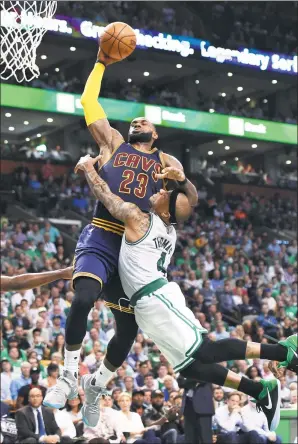  ?? USA TODAY SPORTS ?? Cleveland Cavaliers’ LeBron James soars above Boston Celtics’ Isaiah Thomas during Game 1 of the NBA Eastern Conference final at Boston’s TD Garden on Wednesday. The Cavs won 117-104.