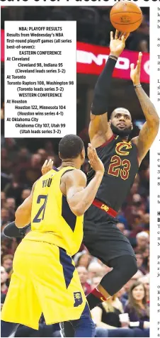  ?? AFP ?? LEBRON JAMES (#23) of the Cleveland Cavaliers takes a shot over Thaddeus Young (#21) of the Indiana Pacers during the second half of Game Five of the Eastern Conference Quarterfin­als during the 2018 NBA Playoffs at Quicken Loans Arena on April 25 in Cleveland, Ohio.