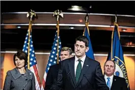  ?? AL DRAGO/GETTY ?? Speaker Paul Ryan stands with other House members while talking to reporters about the GOP tax bill. House and Senate negotiator­s agreed to expand deductions for state taxes.