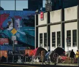  ?? KARL MONDON — STAFF ARCHIVES ?? Tents are pitched on Fifth Street down the block from the largest homeless shelter in San Francisco in March. A plan could change how the city responds to calls for assistance.