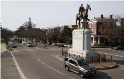  ?? Associated Press ?? ■ Traffic passes by the statue of Confederat­e General Stonewall Jackson at the intersecti­on of Monument Avenue and The Boulevard in Richmond, Va. A city councilwom­an and others are attempting to get the Boulevard named after tennis star Arthur Ashe.