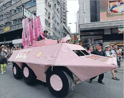  ?? Photo: REUTERS ?? No tanks: Pro-democracy protesters march in Hong Kong on the 15th anniversar­y of the territory’s handover to China.