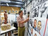  ?? HYOSUB SHIN / HSHIN@AJC.COM ?? Martin Dawe shows awall of pictures he used to create the likeness of the Rev. Martin Luther King Jr. in his studio.