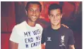  ??  ?? Old friends: Philippe Coutinho meets up with former coach Rodney Goncalves