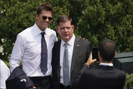  ?? ANDREW HARNIK — THE ASSOCIATED PRESS ?? U.S. Labor Secretary Marty Walsh could be skating over to the National Hockey League players’ union. He’s no stranger to pro athletes. Here he bumped into Tom Brady outside the White House after the Bucs Super Bowl win.