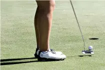  ?? Staff photos by Hunt Mercier ?? LEFT: Elizabeth Elmassian putts on the first hole during the Charities Open at Northridge Country Club. The tournament featured players in the Women’s All Pro Tour.