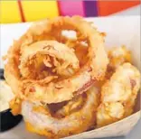  ??  ?? PICKLED onion rings are soaked in red wine vinegar until tart, then deep-fried till golden.