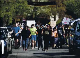  ??  ?? Prior to Sunday’s vigil, people took to the street to call for justic for Tyrell Wilson.