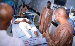  ?? Photo: NAN ?? Governor Babagana Zulum of Borno (right) commiserat­es with a victim of Tuesday’s attack by Boko Haram insurgents in Maiduguri