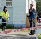  ??  ?? Police at the Naenae home yesterday.