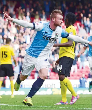  ??  ?? MAN OF THE MOMENT: Ryan Tunnicliff­e celebrates after scoring the equaliser