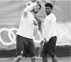  ??  ?? Bayern Munich’s Javi Martinez and David Alaba during training. — Reuters photo