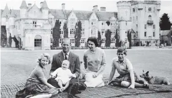  ??  ?? The Queen, Prince Philip and their children, Prince Charles, right, Princess Anne and Prince Andrew on the lawn of Balmoral Castle in Scotland in 1960.
