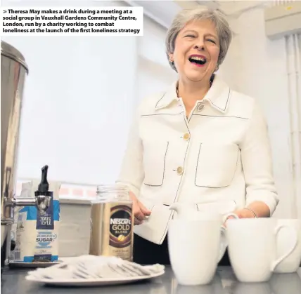  ??  ?? &gt; Theresa May makes a drink during a meeting at a social group in Vauxhall Gardens Community Centre, London, run by a charity working to combat loneliness at the launch of the first loneliness strategy