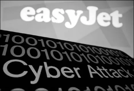  ?? REUTERS ?? A smartphone displays “Cyber Attack” in front of an easyJet logo.