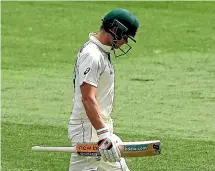  ?? GETTY IMAGES ?? Steve Smith walks disconsola­tely off the MCG after being dismissed for eight on the third day of the second test against India.