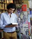  ?? AP/RUSSELL CONTRERAS ?? Marco P. Cremasco, 28, of Sao Paulo, Brazil, browses through Downtown Books, located on the iconic Route 66 in Albuquerqu­e, N.M.