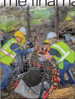  ?? Shelly Thorene / Union Democrat ?? #1pileatati­me staging area crew members secure a load to be skylined up the hill to a dump truck, where crew members release two sides of the net and the trash is dumped out into a tractor trailer. Volunteers include David Goldemberg (from left), of Sonora, Jennifer Grossman (front right), of Sonora, Tyler Grossman (left rear), of Sonora, and Justin Almstrom (right rear), of Crystal Falls.