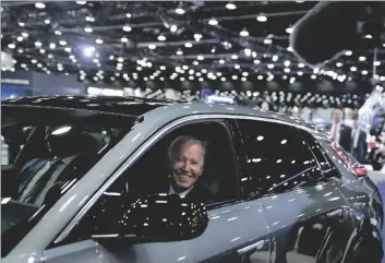  ?? AP PHOTO/EVAN VUCCI, ?? President Joe Biden drives a Cadillac Lyriq through the showroom during a tour at the Detroit Auto Show, in 2022 in Detroit.