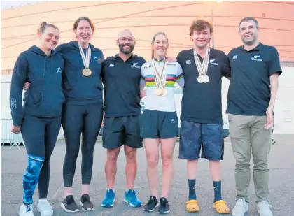  ?? Photo / Paralympic­s New Zealand ?? Nicole Murray (white top) with her three Para Cycling Track World Championsh­ipmedals, along with other New Zealand Para cycling team members.