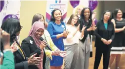  ?? STEVE RUSSELL/TORONTO STAR ?? Members of the first class of Women Win TO clap as they introduce themselves.