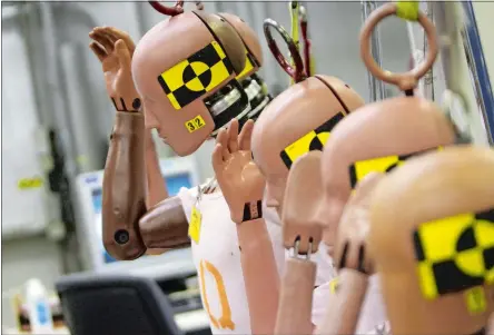  ?? ANDRE J. JACKSON/DETROIT FREE PRESS/TNS ?? A row of Hybrid III dummies are ready to be vehicle crash tested at the GM Milford Proving Grounds in Milford, Mich.