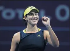  ??  ?? Muguruza celebra con una sonrisa su triunfo de ayer en Doha.