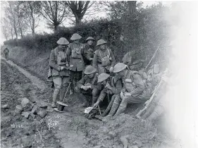  ?? PHOTO: ROYAL NEW ZEALAND RETURNED AND SERVICES’ ASSOCIATIO­N ?? New Zealand soldiers sending word by telephone in Le Quesnoy, France, about the armistice.