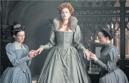  ??  ?? GRACEFULLY DONE: From left, Grace Molony as Dorothy Stafford, Margot Robbie as Queen Elizabeth I and Georgia Burnell as Kate Carey in a scene from ‘Mary Queen of Scots’.