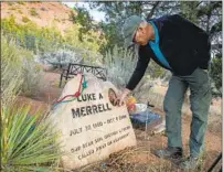  ??  ?? MERRELL VISITS the graves of his son, Luke, 24, and wife, LouAnn. They died while climbing and hiking, respective­ly.