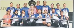  ??  ?? Girls champions SMK St Columba and their coach Rudi Naziri (fifth right) posing with Mary (four left) and Mikar (third left) after the prize presentati­on.