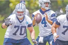  ?? SMILEY N. POOL/THE DALLAS MORNING NEWS VIA AP ?? Cowboys offensive guard Zack Martin, left, agreed to terms of an $84 million, six-year contract extension, the most for that position in the NFL.